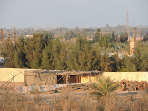 This is the wall on the back part of the property, with a mosque just beyond it. 